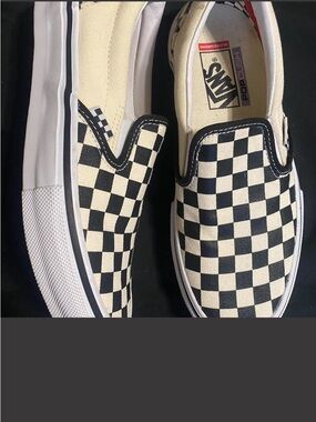 Vans Black and Cream Checkerboard Classic Slip-On Sneakers